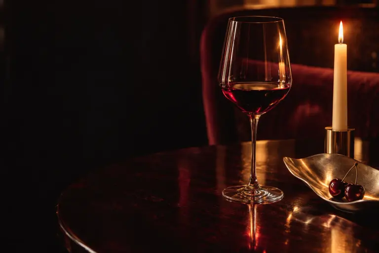 Original candlelit wine-bar imagery for the Harbour and Vine fictional concept